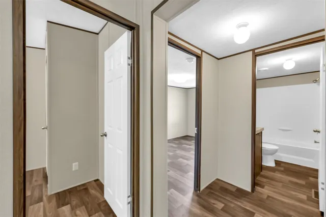 a view of a bathroom from a hallway