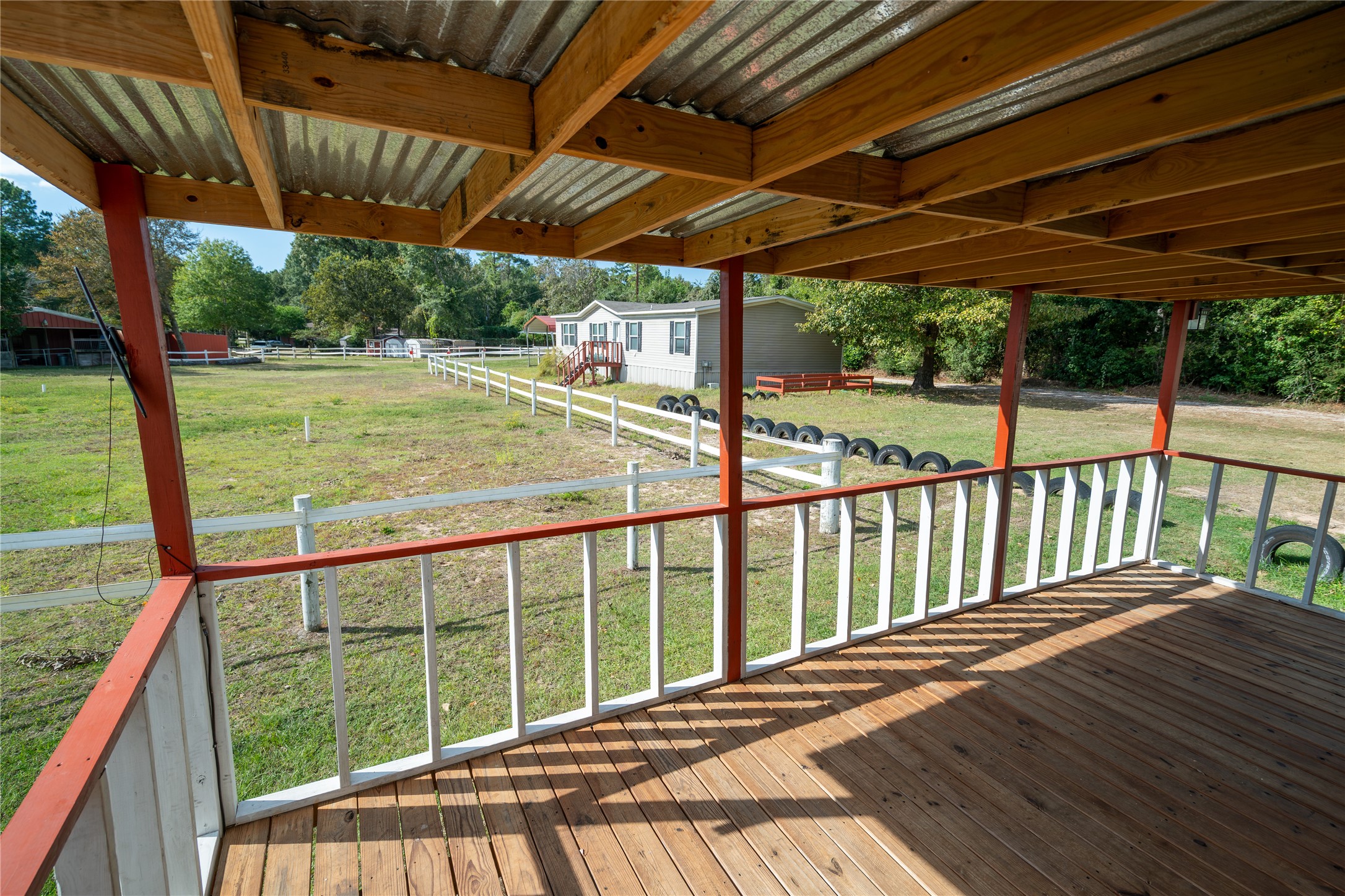 26768 A Dobbin-Huffsmith Road Magnolia, TX 77354 - Photo 26 of 29 a view of a backyard with wooden floor