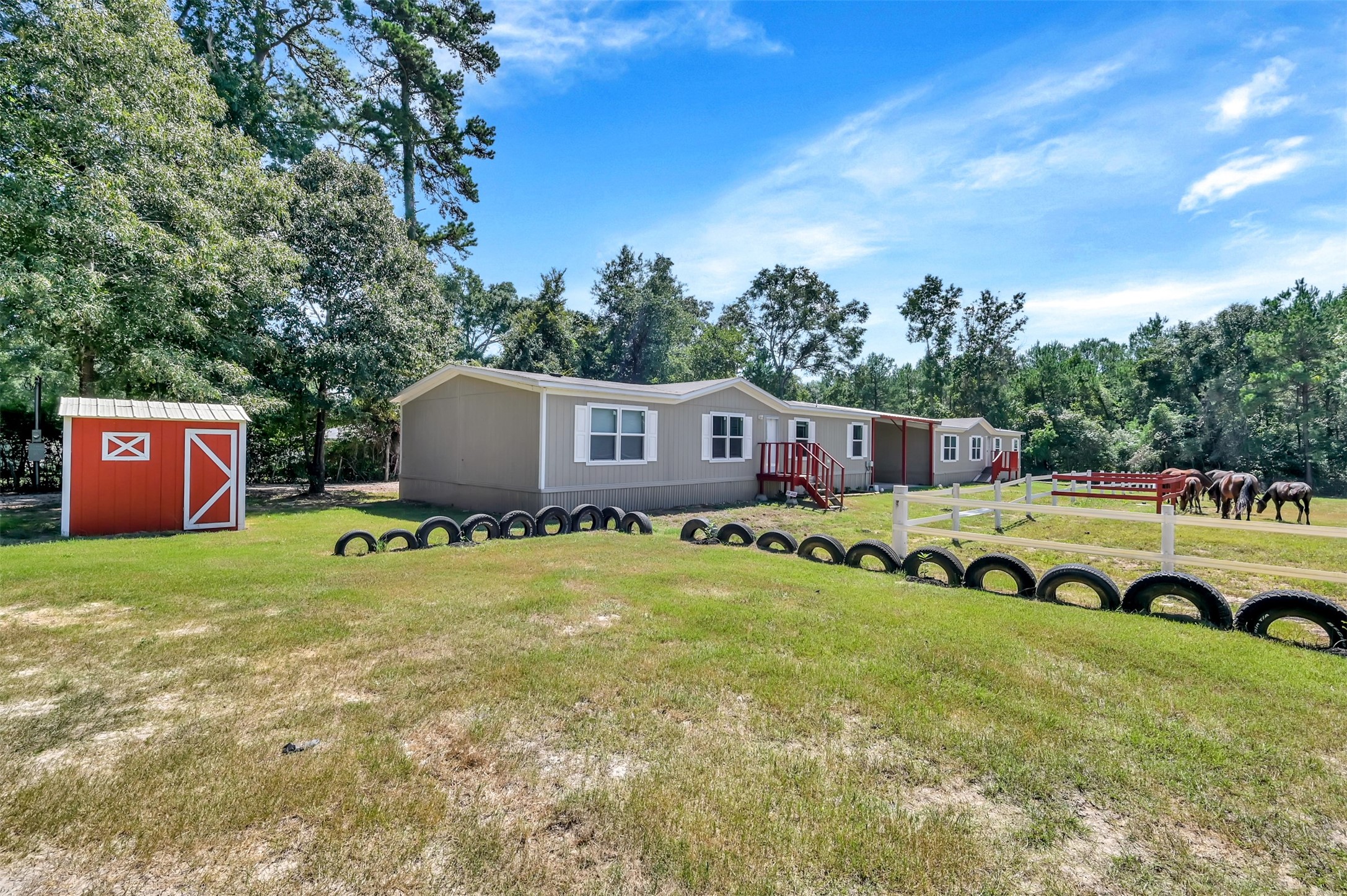 26768 A Dobbin-Huffsmith Road Magnolia, TX 77354 - Photo 5 of 29 a swimming pool with outdoor seating and yard