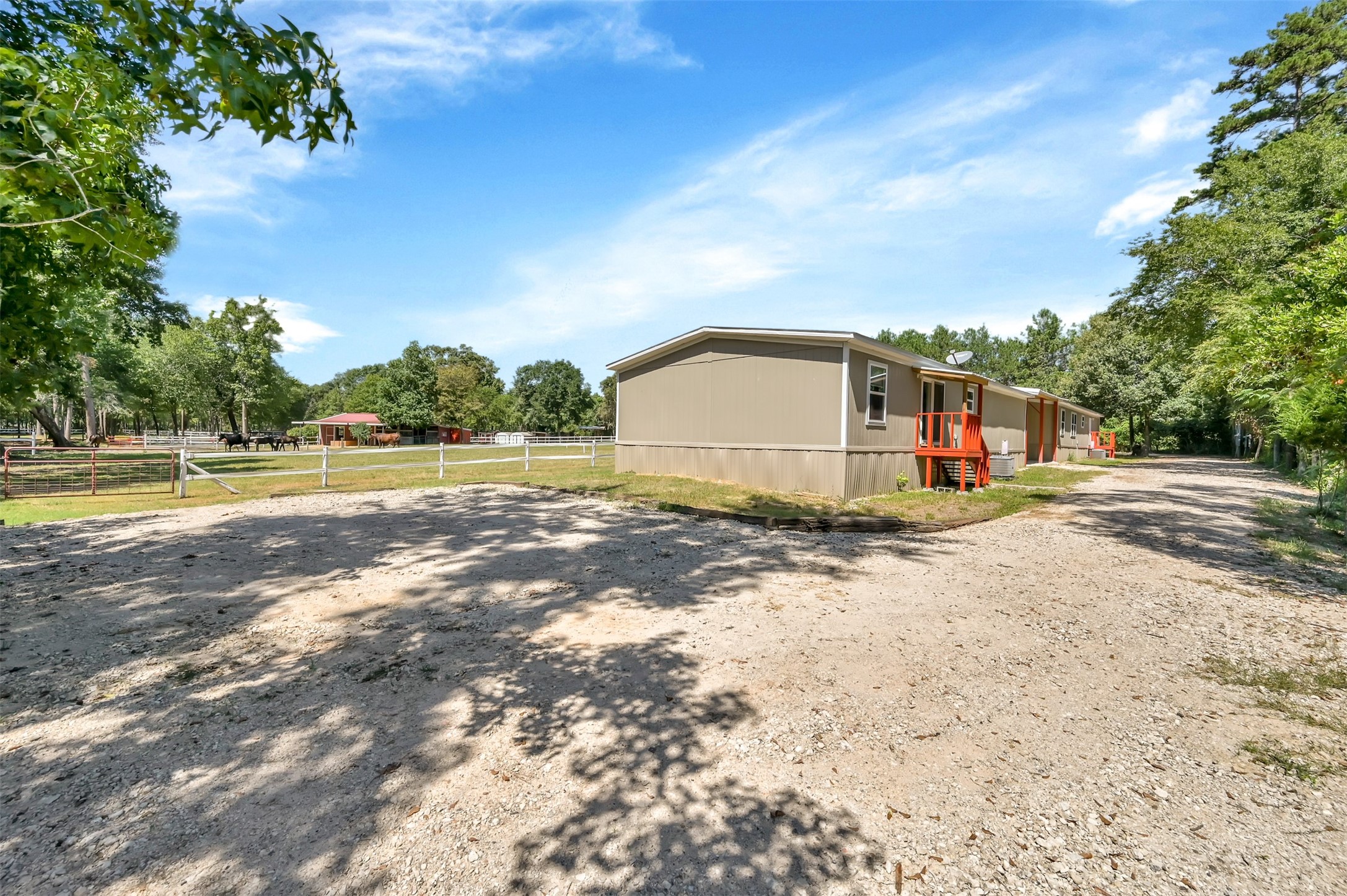 26768 A Dobbin-Huffsmith Road Magnolia, TX 77354 - Photo 6 of 29 a view of a water house with a yard