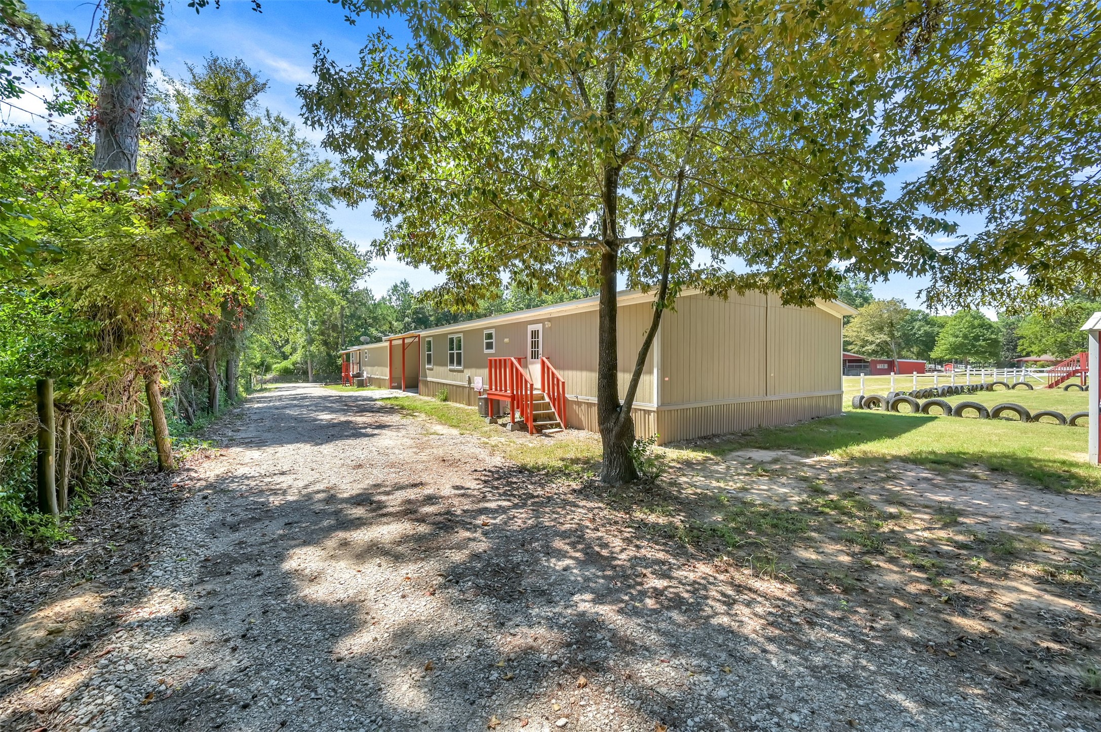 26768 A Dobbin-Huffsmith Road Magnolia, TX 77354 - Photo 7 of 29 a backyard of a house with a yard and tree
