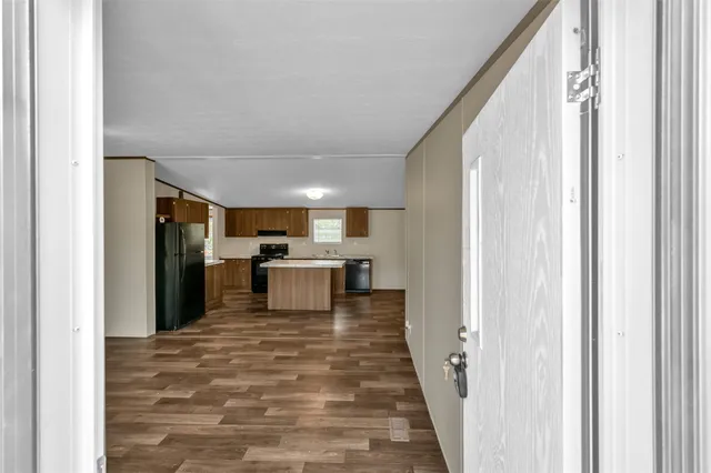 a view of a kitchen from the hallway