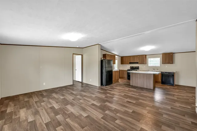 a view of kitchen with wooden floor