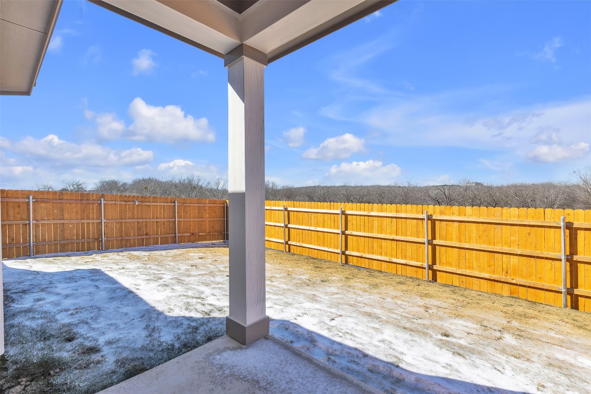 9200 Furman Drive Austin, TX 78747 - Photo 14 of 15 Fenced backyard with a patio area