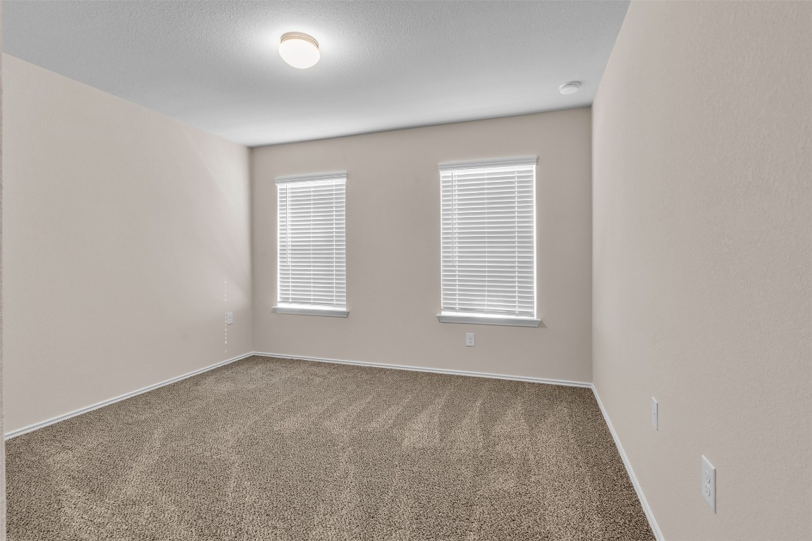9200 Furman Drive Austin, TX 78747 - Photo 5 of 15 Carpeted spare room with baseboards