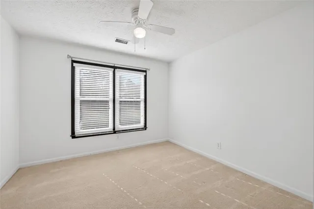 a kitchen with stainless steel appliances granite countertop a stove a refrigerator and a refrigerator