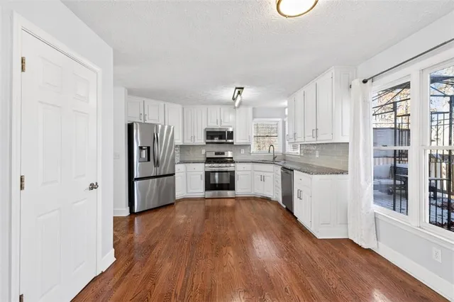 a view of entryway with wooden floor