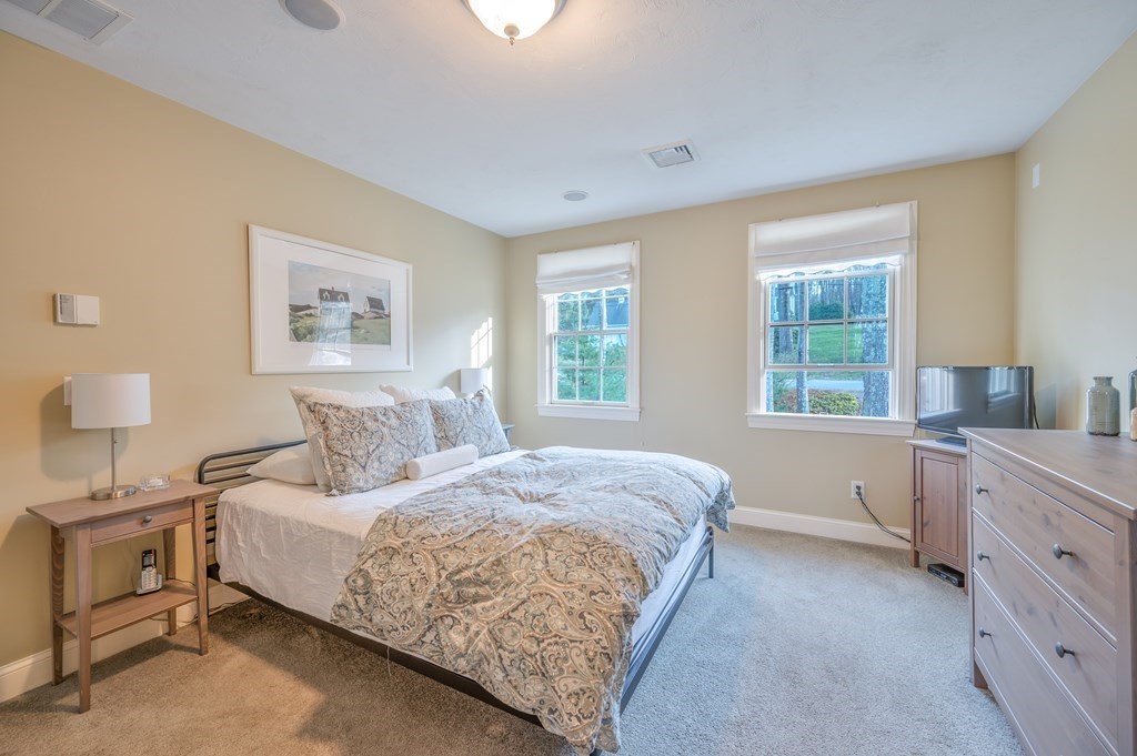 91 Hartness Road Sutton, MA 01590 - Photo 19 of 27 a bedroom with a bed and a lamp on dresser