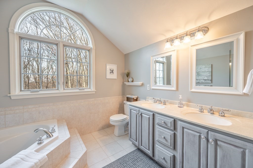 91 Hartness Road Sutton, MA 01590 - Photo 20 of 27 a bathroom with a sink and a mirror