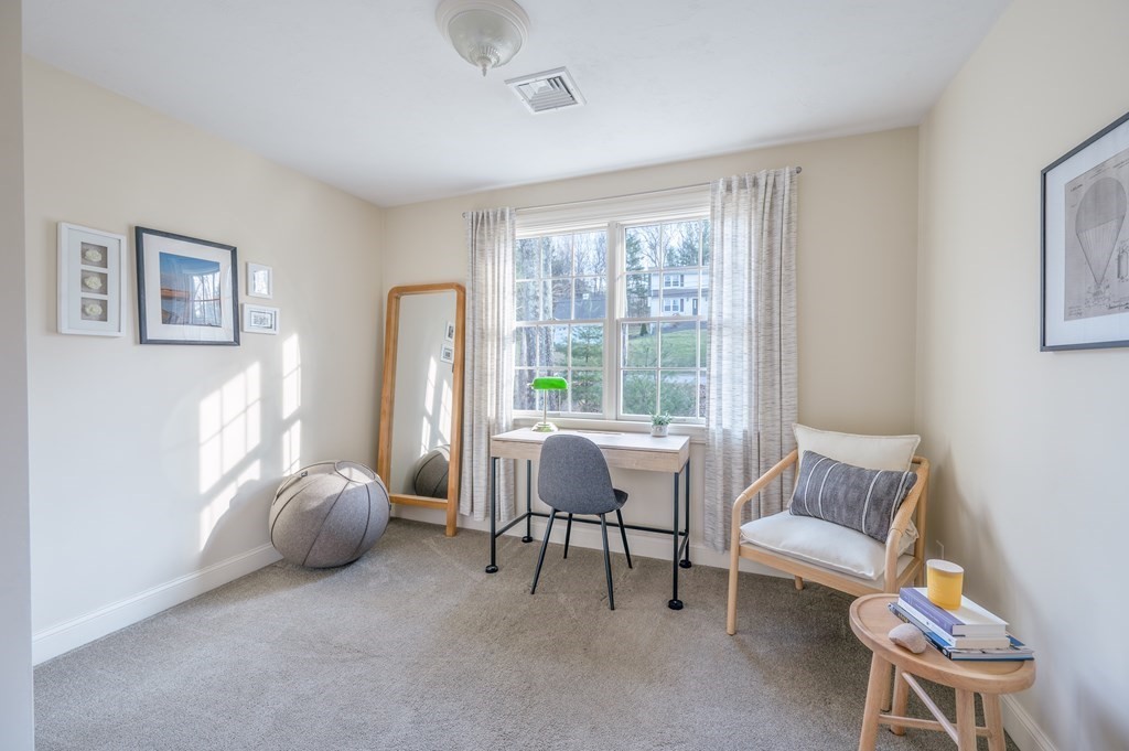 91 Hartness Road Sutton, MA 01590 - Photo 25 of 27 a living room with furniture and a window