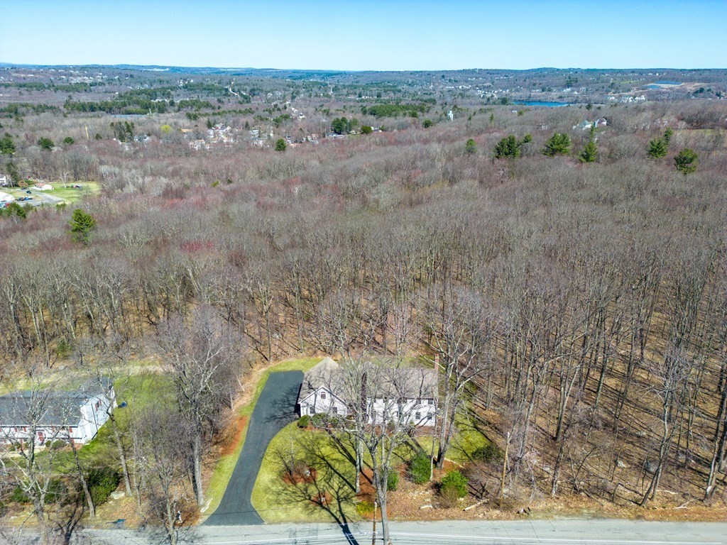 91 Hartness Road Sutton, MA 01590 - Photo 5 of 27 a view of a yard with a garden