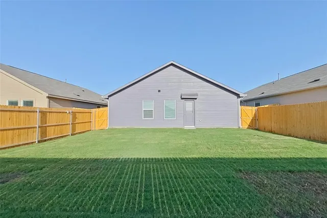 a view of a backyard of the house
