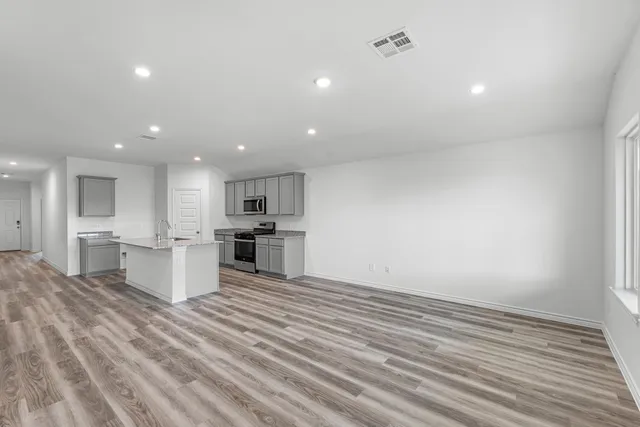 a view of kitchen with wooden floor