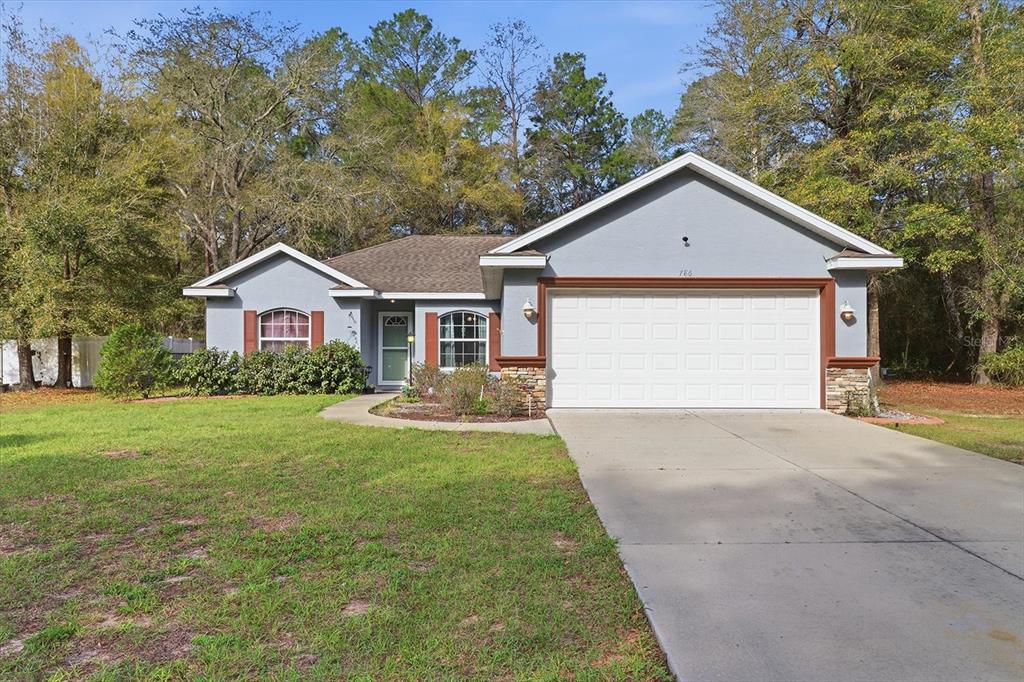 a front view of a house with yard
