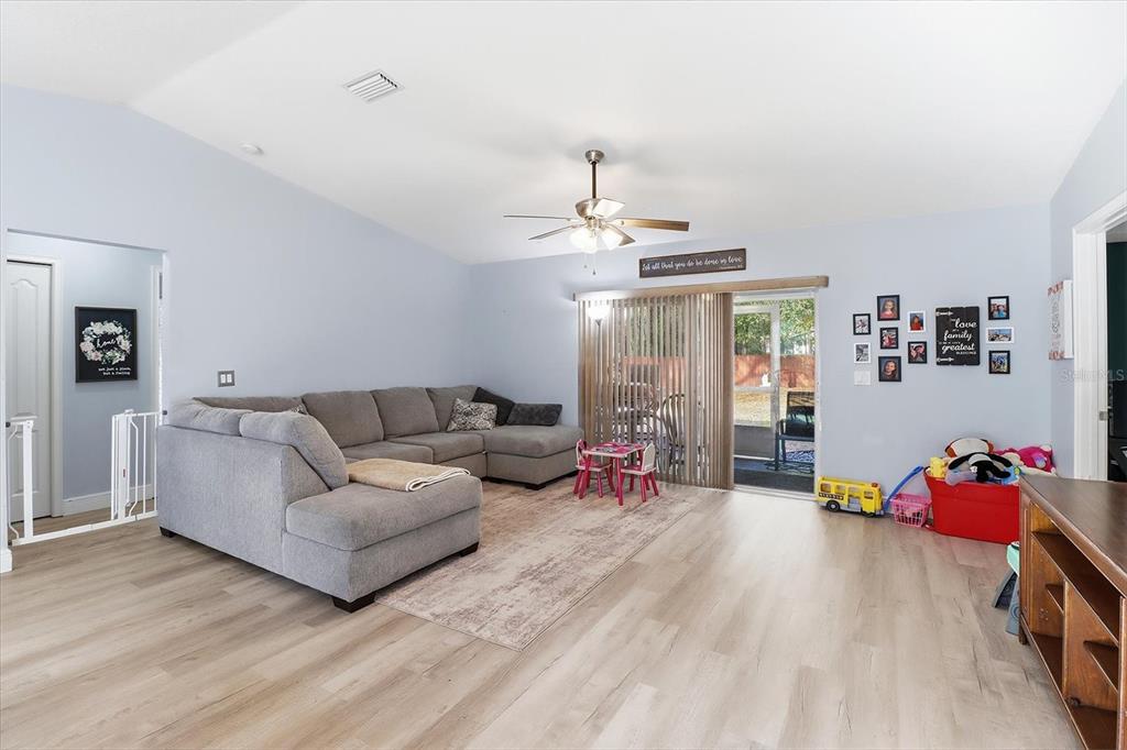 786 North Dugan Avenue Inverness, FL 34453 - Photo 11 of 44 a living room with furniture and a wooden floor
