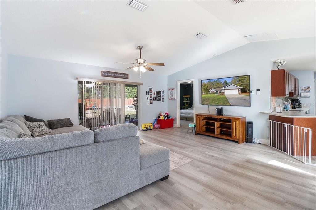 786 North Dugan Avenue Inverness, FL 34453 - Photo 12 of 44 a living room with furniture and wooden floor