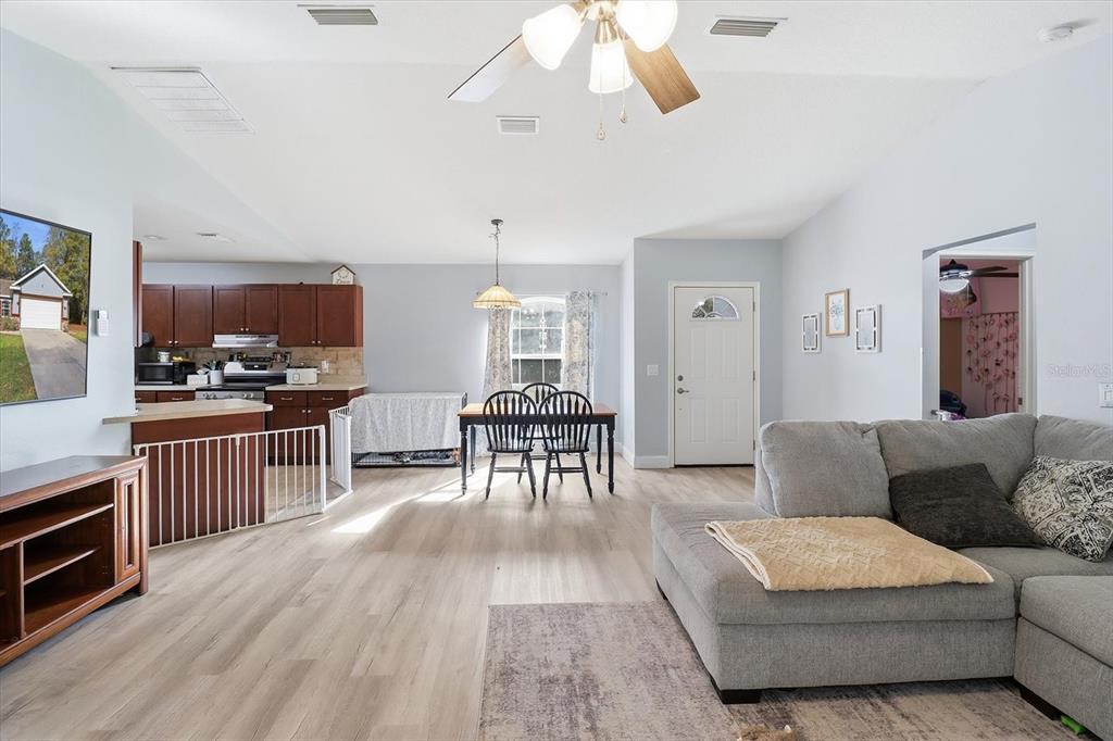 786 North Dugan Avenue Inverness, FL 34453 - Photo 14 of 44 a living room with furniture and kitchen view