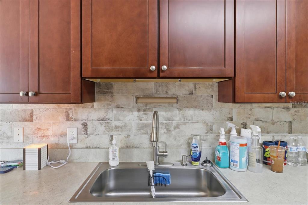 786 North Dugan Avenue Inverness, FL 34453 - Photo 20 of 44 a kitchen with a sink and cabinets