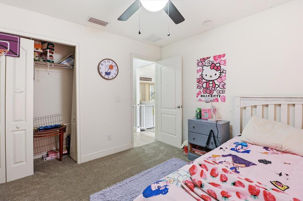 786 North Dugan Avenue Inverness, FL 34453 - Photo 25 of 44 a bedroom with a bed and a dresser in it