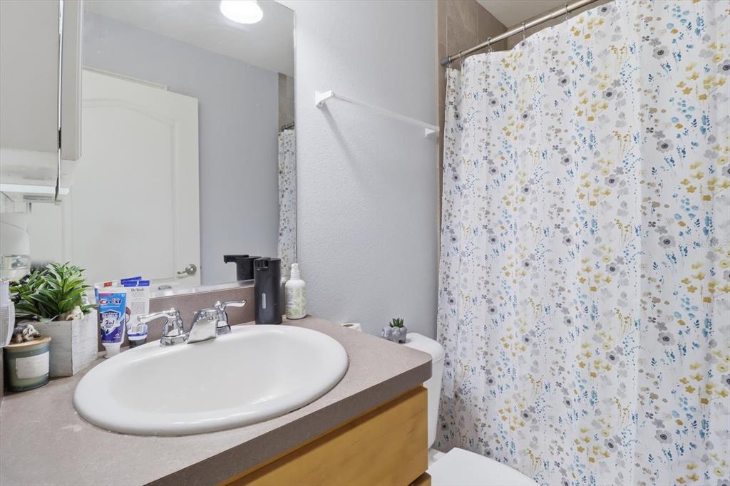 786 North Dugan Avenue Inverness, FL 34453 - Photo 27 of 44 a bathroom with a sink a toilet and mirror