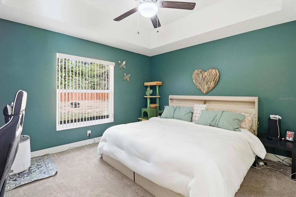 786 North Dugan Avenue Inverness, FL 34453 - Photo 29 of 44 a bedroom with a large bed and a window