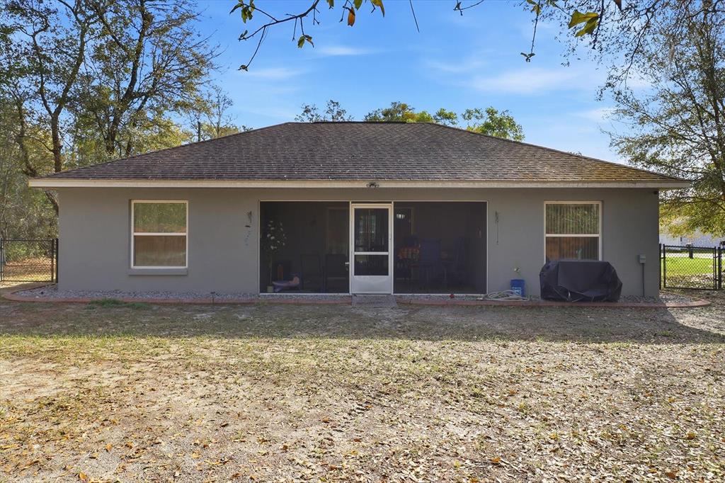 786 North Dugan Avenue Inverness, FL 34453 - Photo 3 of 44 a view of a house with a yard