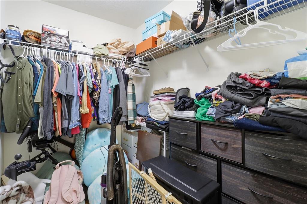 786 North Dugan Avenue Inverness, FL 34453 - Photo 34 of 44 a view of walk in closet with clothes and shoes