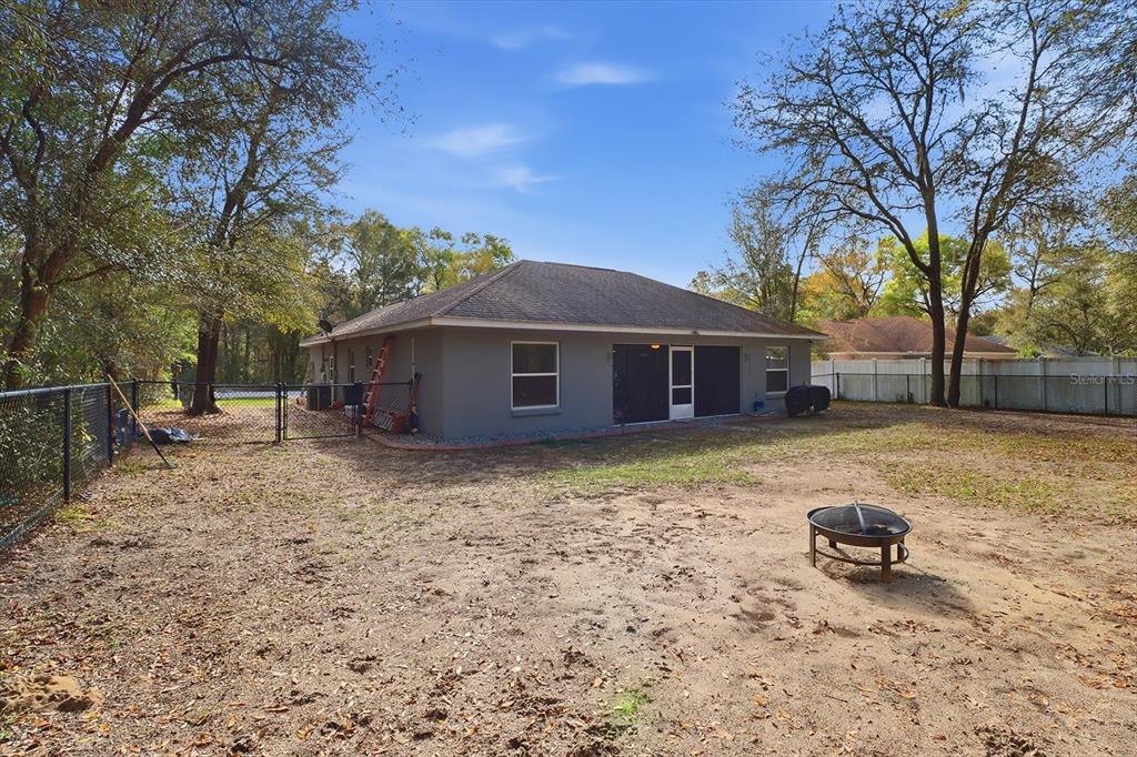 786 North Dugan Avenue Inverness, FL 34453 - Photo 40 of 44 a house view with a garden space