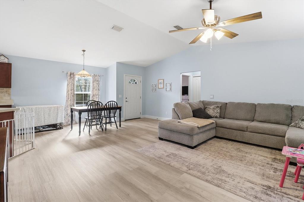 786 North Dugan Avenue Inverness, FL 34453 - Photo 10 of 44 a living room with furniture and a wooden floor