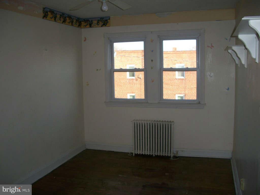 15 Warren Road Baltimore, MD 21221 - Photo 7 of 10 an empty room with a window