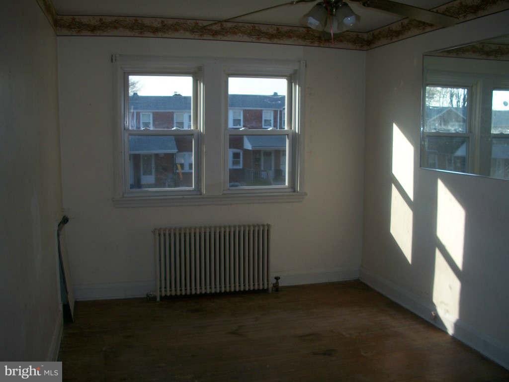 15 Warren Road Baltimore, MD 21221 - Photo 8 of 10 a view of an empty room with a window