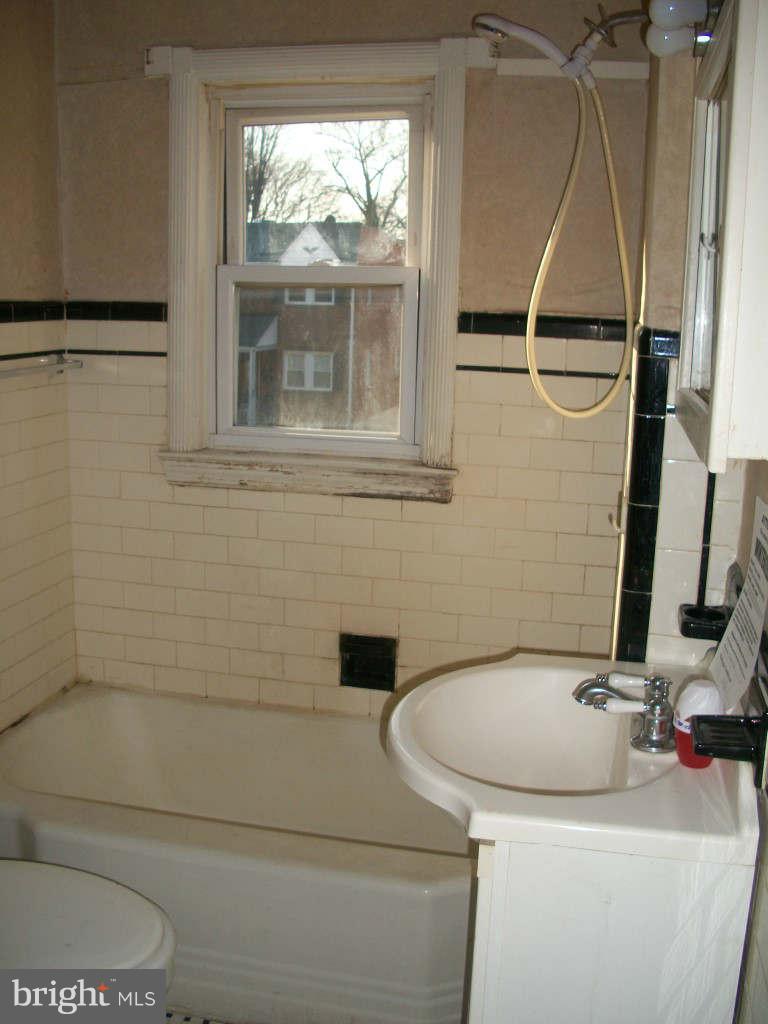 15 Warren Road Baltimore, MD 21221 - Photo 9 of 10 a bathroom with a toilet and a sink