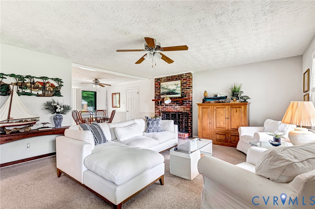635 River Oaks Road Center Cross, VA 22437 - Photo 14 of 63 Spacious living area featuring a brick fireplace,