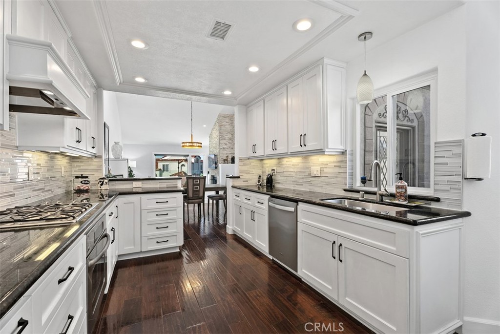3 Nice Laguna Niguel, CA 92677 - Photo 11 of 66 a kitchen with stainless steel appliances granite countertop a stove sink and cabinets
