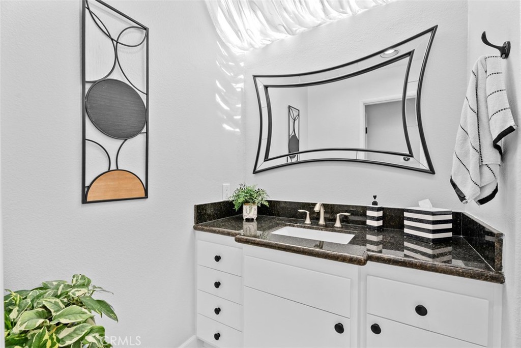 3 Nice Laguna Niguel, CA 92677 - Photo 20 of 66 a bathroom with a sink and a mirror