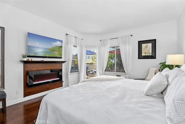 a bedroom with a bed and a fireplace