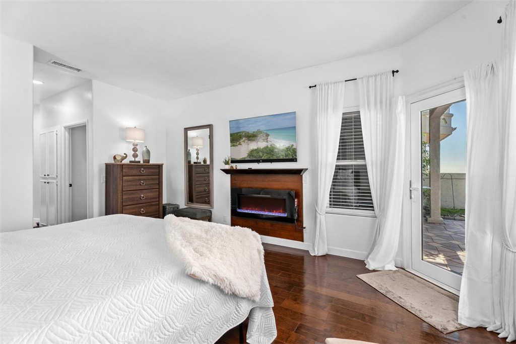 3 Nice Laguna Niguel, CA 92677 - Photo 28 of 66 a bedroom with a bed and a fireplace