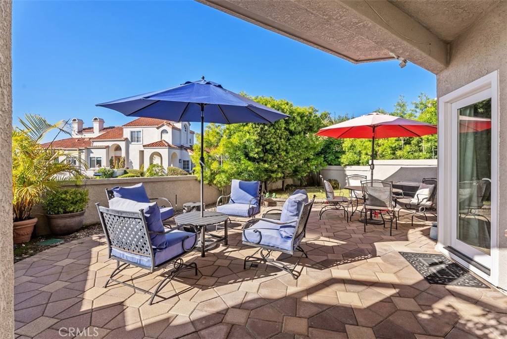 3 Nice Laguna Niguel, CA 92677 - Photo 32 of 66 a view of a patio with furniture and umbrella