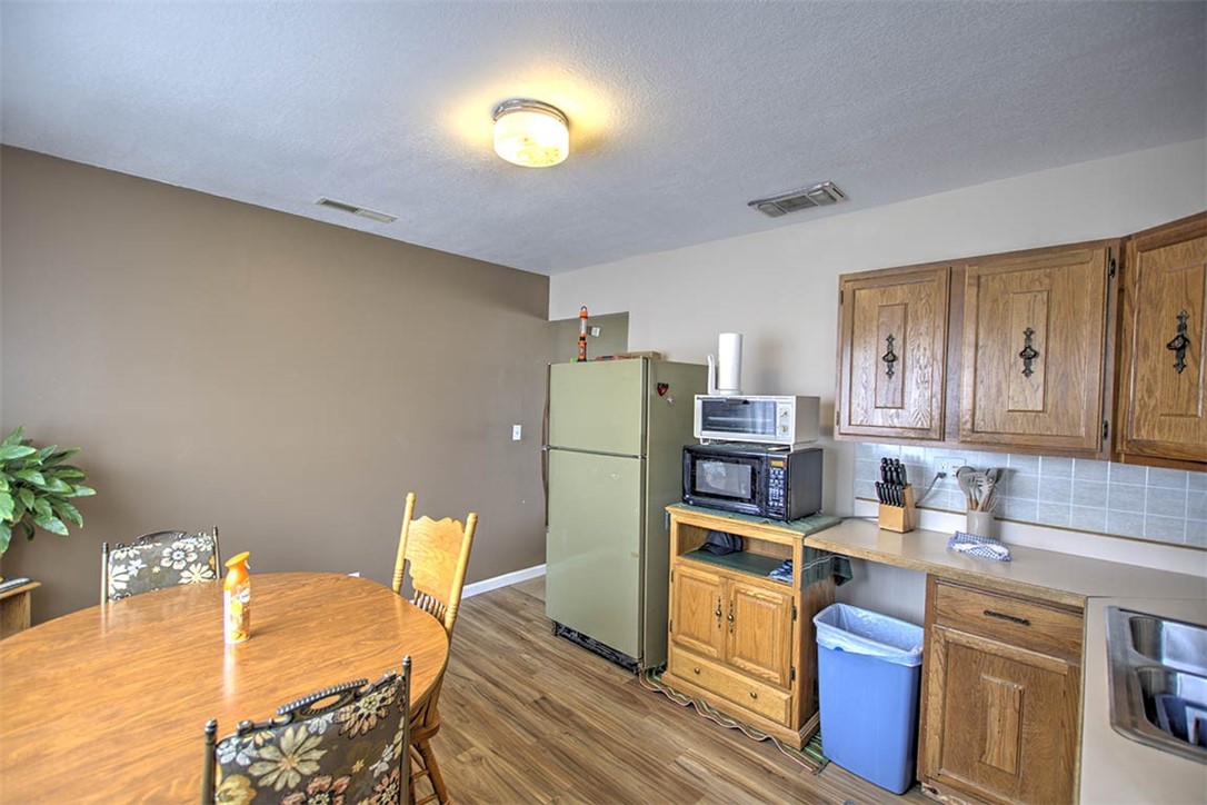 2809 East Cardinal Drive Decatur, IL 62526 - Photo 7 of 20 a kitchen with refrigerator and stove