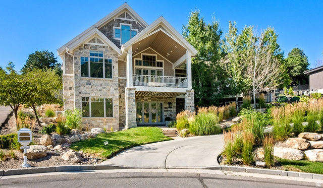 3 Carriagewood Cove, Unit 1088 Sandy, UT 84092 - Photo 4 of 79 Stone and siding exterior with gabled roofline and multiple window configurations
