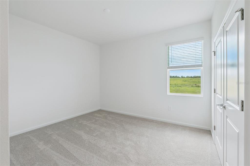1672 Rider Rain Lane Apopka, FL 32703 - Photo 20 of 35 an empty room with windows