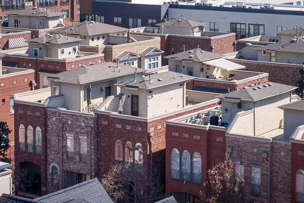 a view of a brick building with many windows