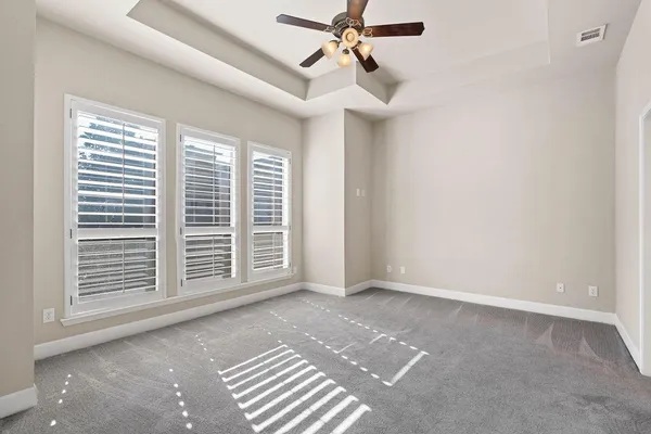 a view of a livingroom with a ceiling fan and window