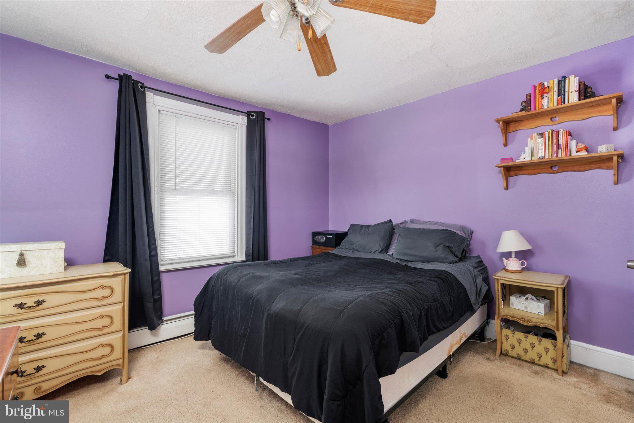 1013 West 5th Street Florence, NJ 08518 - Photo 14 of 21 a bedroom with a bed and a window