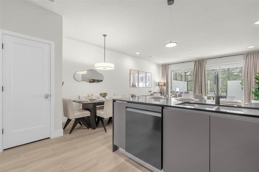 1411 Serendipity Lane Clermont, FL 34714 - Photo 11 of 15 a kitchen with center island and stainless steel appliances