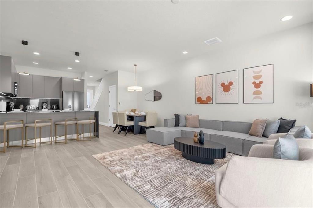 1411 Serendipity Lane Clermont, FL 34714 - Photo 4 of 15 a living room with furniture and kitchen view