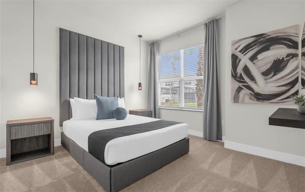 1411 Serendipity Lane Clermont, FL 34714 - Photo 6 of 15 a bedroom with a bed and a painting on the wall