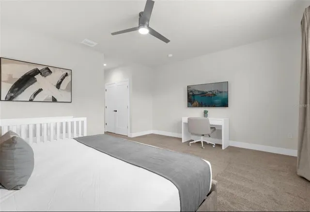 a bedroom with a bed and a chair