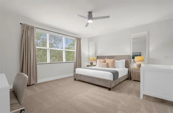 a bed room with a bed and a chair