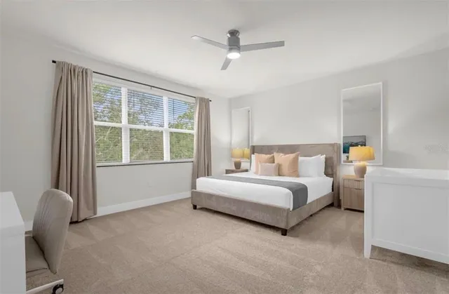 a bed room with a bed and a chair